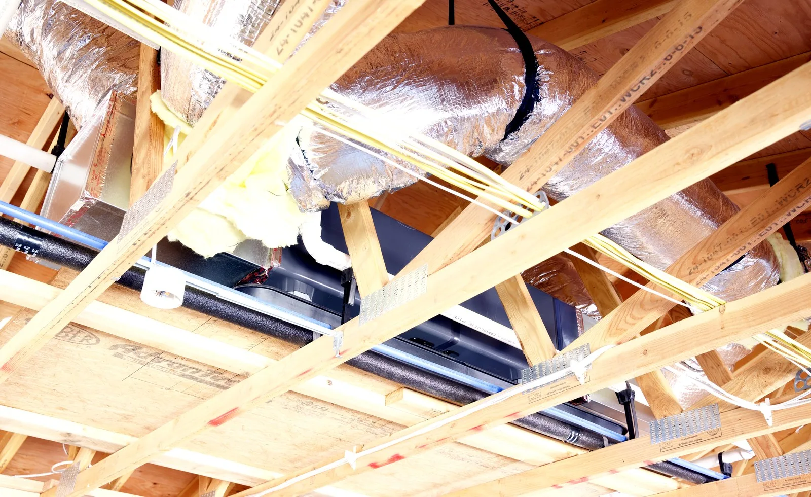 Open framing with HVAC rough-in during new construction